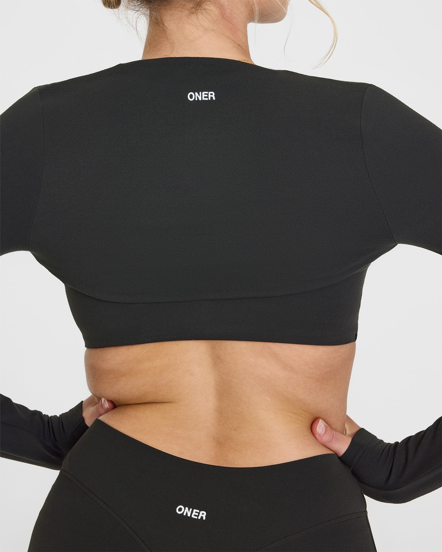 SoftMotion™ Long Sleeve Shrug with White Logo | Soft Black