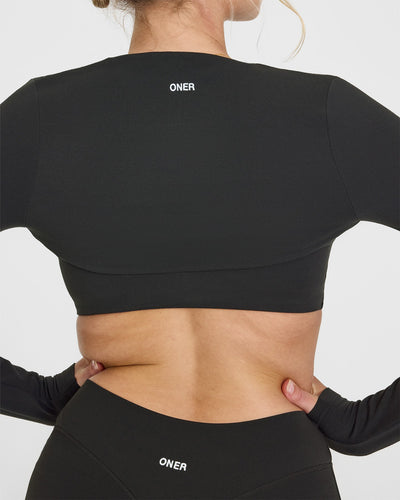 SoftMotion™ Long Sleeve Shrug with White Logo | Soft Black