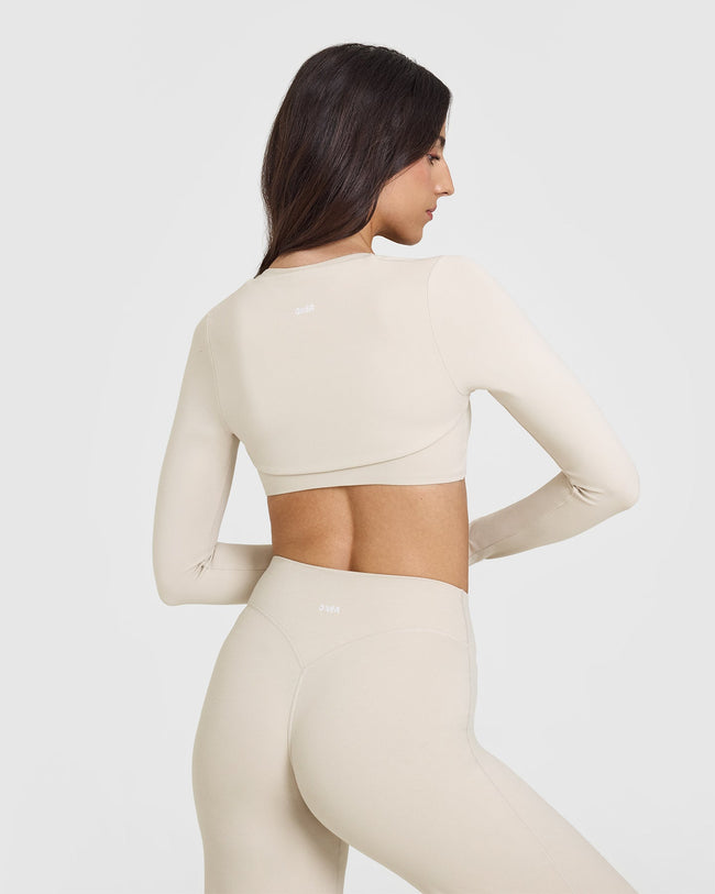 SoftMotion™ Long Sleeve Shrug with White Logo | Sand