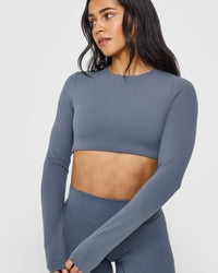 SoftMotion™ Long Sleeve Crop Top with White Logo | Granite Blue