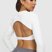 SoftMotion™ Long Sleeve Crop Top with White Logo | White