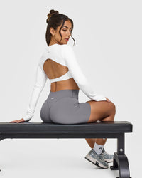 SoftMotion™ Long Sleeve Crop Top with White Logo | White