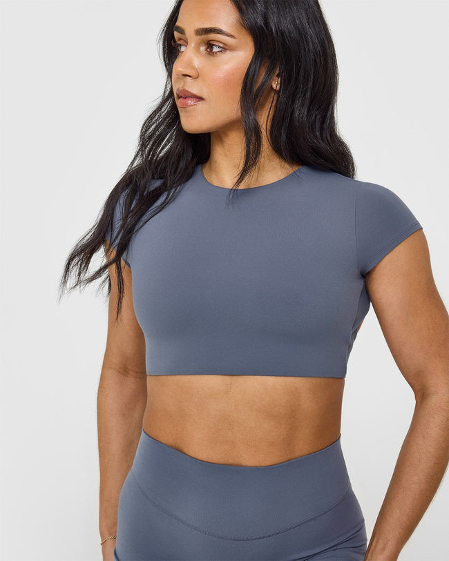 SoftMotion™ Short Sleeve Crop Top with White Logo | Granite Blue