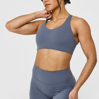 SoftMotion™ Sports Bra with White Logo | Granite Blue