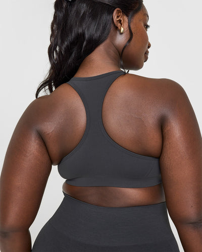 Effortless Seamless Racer Back Sports Bra with White Logo | Coal