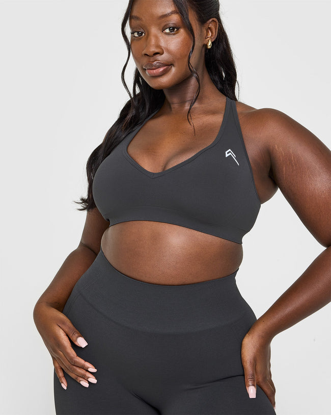 Effortless Seamless Racer Back Sports Bra with White Logo | Coal