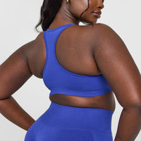 Effortless Seamless Racer Back Sports Bra with White Logo | Space Blue