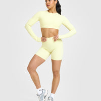 SoftMotion™ Long Sleeve Crop Top with White Logo | Pastel Yellow