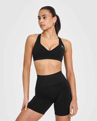 Effortless Seamless Racer Back Sports Bra with White Logo | Black