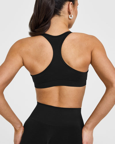 Effortless Seamless Racer Back Sports Bra with White Logo | Black