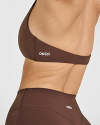 SoftMotion™ Minimal Halter Neck Bralette with White Logo | Espresso Brown