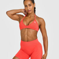 EnhanceLift™ Seamless Minimal Halter Neck Bralette with White Logo | Charged Coral