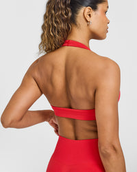 Effortless Seamless Halter Neck Sports Bra with White Logo | Muscle Mommy Red