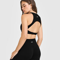 SoftMotion™ High Neck Sports Bra with White Logo | Black