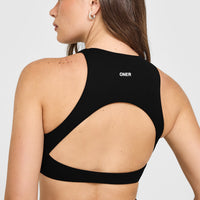 SoftMotion™ High Neck Sports Bra with White Logo | Black