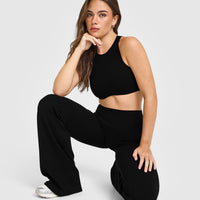 SoftMotion™ High Neck Sports Bra with White Logo | Black