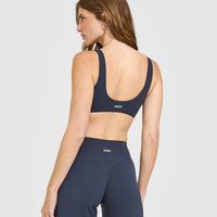 SoftMotion™ Scoop Back Bralette with White Logo | True Blue