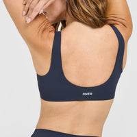 SoftMotion™ Scoop Back Bralette with White Logo | True Blue