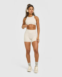 SoftMotion™ High Neck Sports Bra with White Logo | Sand