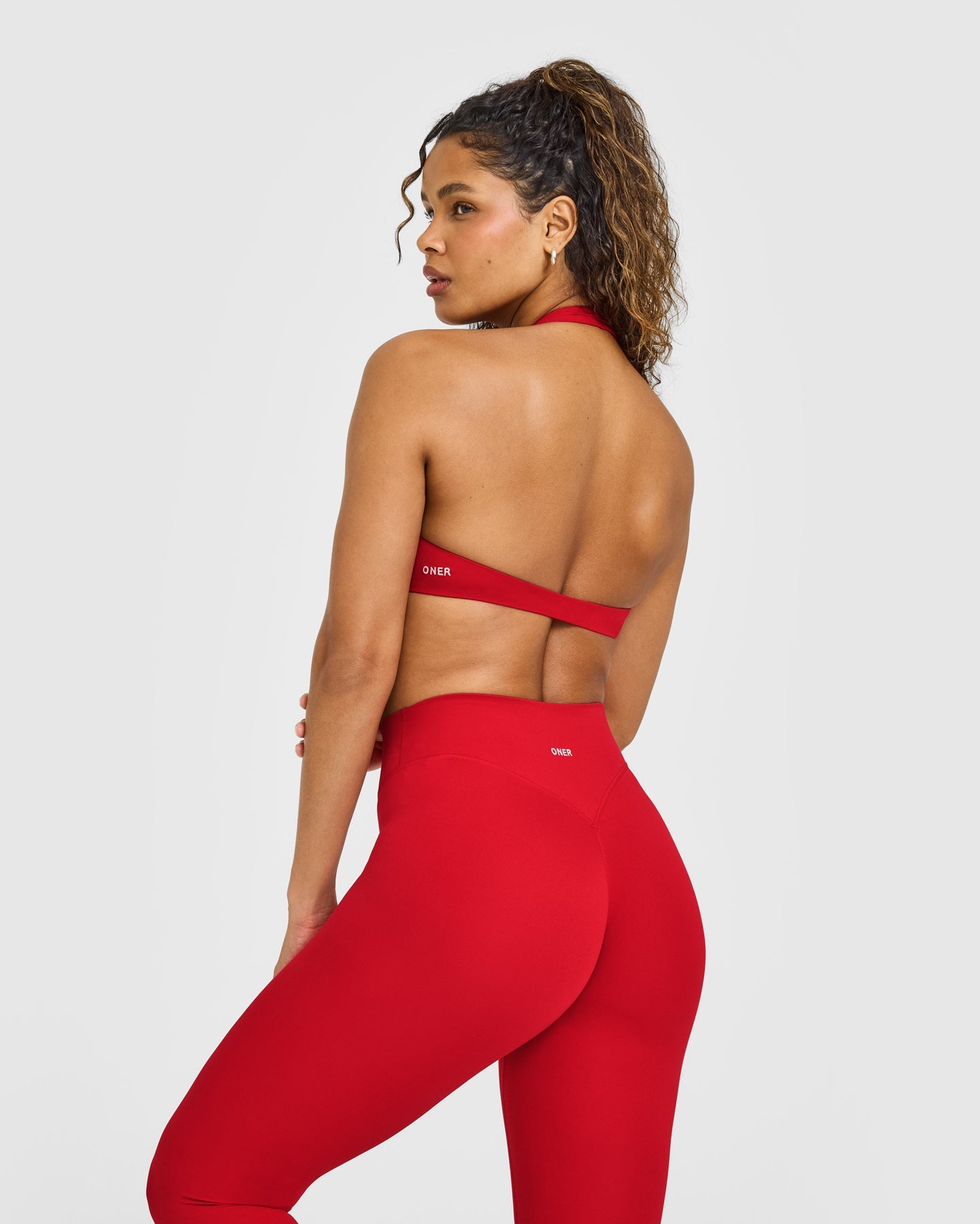 SoftMotion™ Minimal Halter Neck Bralette with White Logo | Light Toasted Red