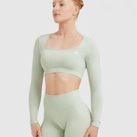 Effortless Square Neck Crop Long Sleeve Top with White Logo | Tea Green
