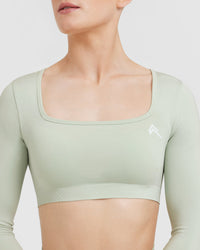 Effortless Square Neck Crop Long Sleeve Top with White Logo | Tea Green