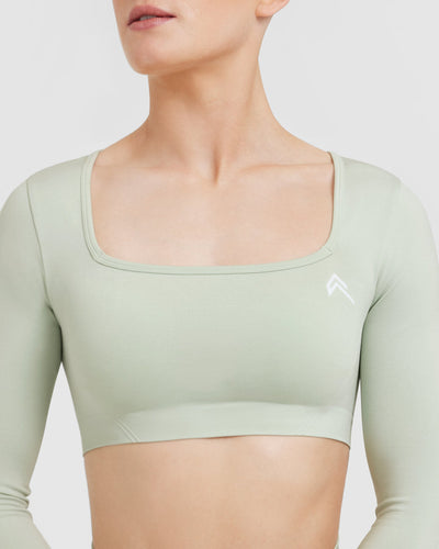 Effortless Square Neck Crop Long Sleeve Top with White Logo | Tea Green