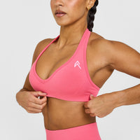 Effortless Seamless Halter Neck Sports Bra with White Logo | Hot Girl Pink