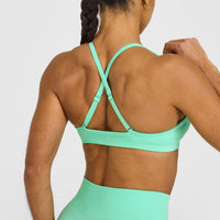 EnhanceLift™ Seamless Strappy Sports Bra with White Logo | Peppermint Green
