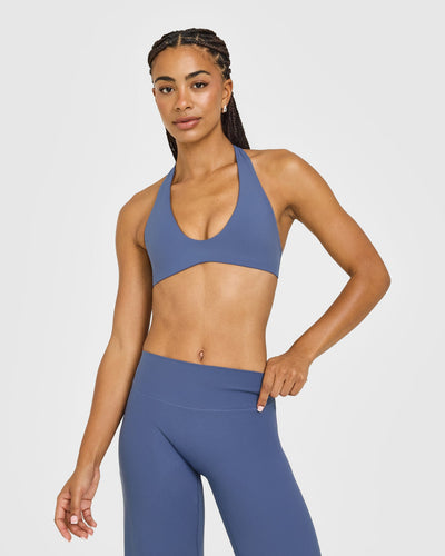 SoftMotion™ Minimal Halter Neck Bralette with White Logo | Slate Blue