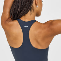 SoftMotion™ Racer Back Mid Vest with Built in Bra Shelf with White Logo | True Blue