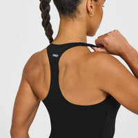 SoftMotion™ Racer Back Vest with Built in Bra Shelf with White Logo | Black