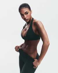 SoftMotion™ Minimal Halter Neck Bralette with Grey Logo | Emerald Noir