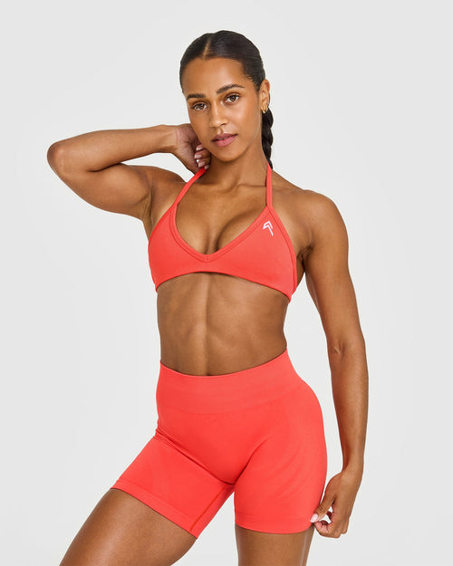 Oner Modal EnhanceLift™ Seamless Minimal Halter Neck Bralette with White Logo | Charged Coral