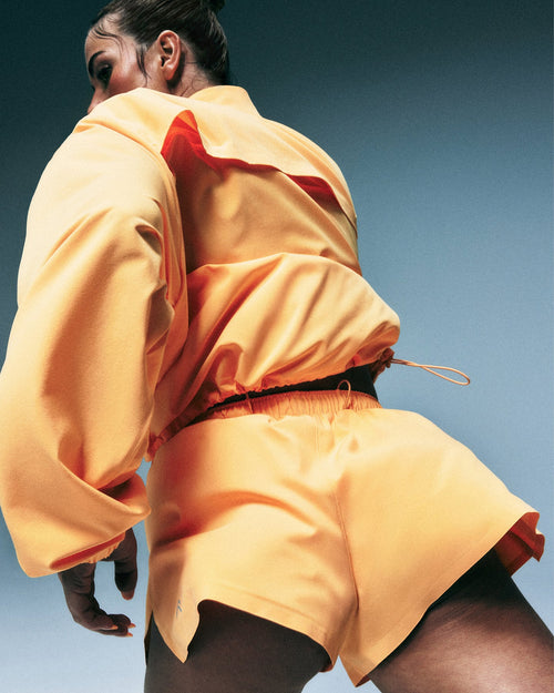 AirMove™ Lined Shorts 2" with Pocket and Reflective Logo | Powdered Orange
