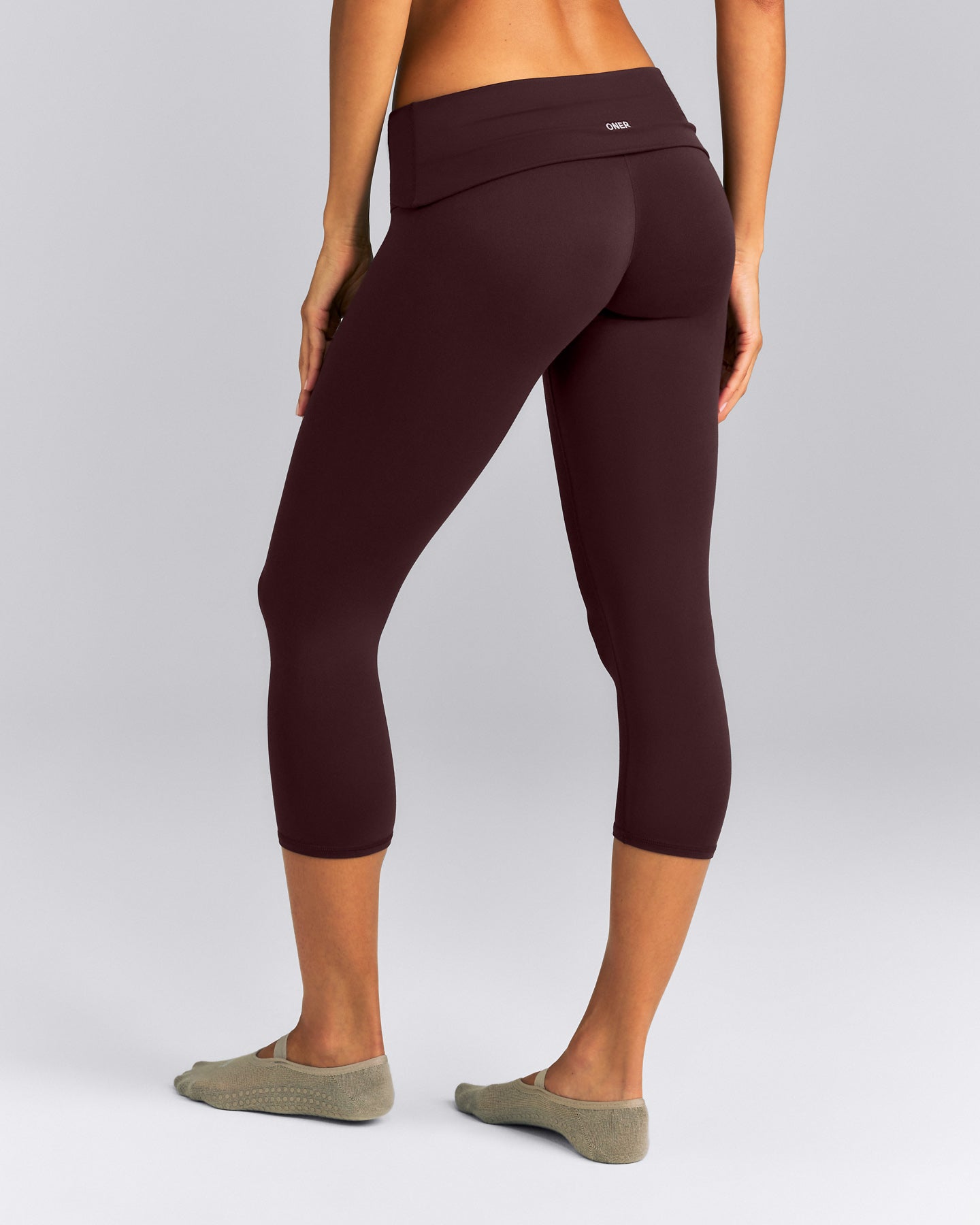 SoftMotion™ Fold Over Capri Leggings New Branding | Plum Brown