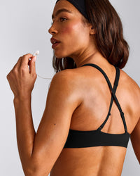 EasyLift™ Cross Back Sports Bra with Grey Logo | Black