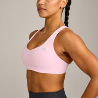 EasyLift™ Cross Back Sports Bra with Grey Logo | Chalk Pink