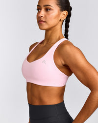EasyLift™ Cross Back Sports Bra with Grey Logo | Chalk Pink