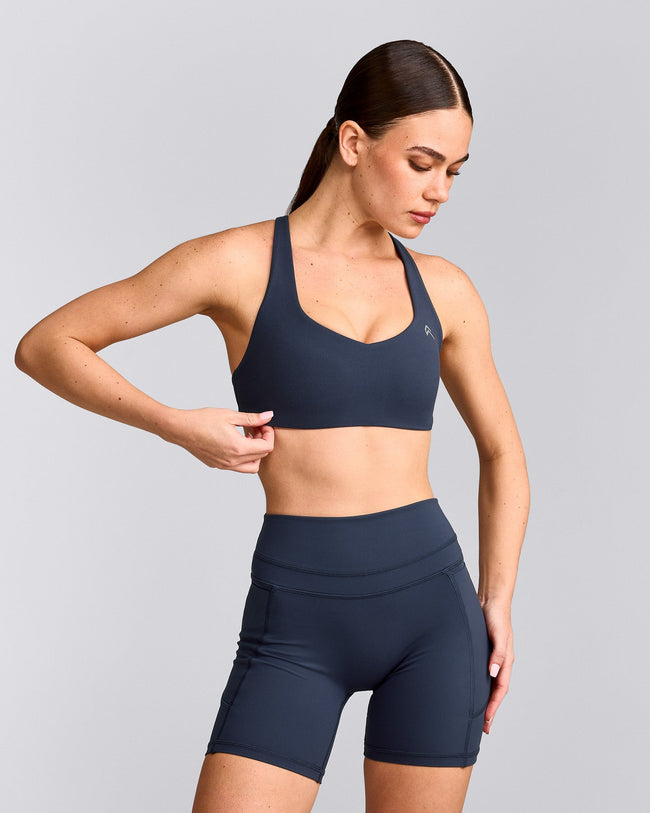 EasyLift™ Cross Back Sports Bra with Grey Logo | True Blue