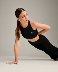 EasyLift™ High Neck Sports Bra with Grey Logo | Black