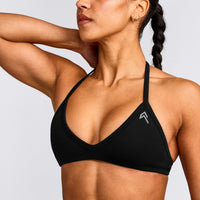 EnhanceLift™ Seamless Minimal Halter Neck Bralette with Grey Logo | Black