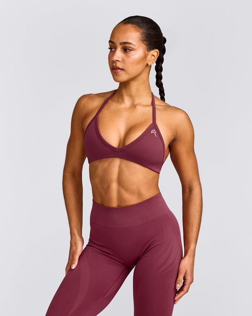 EnhanceLift™ Seamless Minimal Halter Neck Bralette with Grey Logo | Burnt Maroon