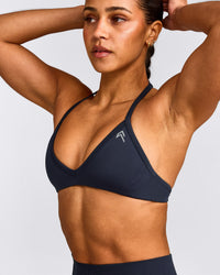 EnhanceLift™ Seamless Minimal Halter Neck Bralette with Grey Logo | True Blue
