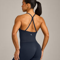 EnhanceLift™ Seamless Strappy Racer Vest with Built in Bra Shelf with Grey Logo | True Blue