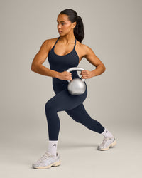 EnhanceLift™ Seamless Strappy Racer Vest with Built in Bra Shelf with Grey Logo | True Blue