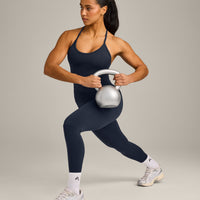 EnhanceLift™ Seamless Strappy Racer Vest with Built in Bra Shelf with Grey Logo | True Blue
