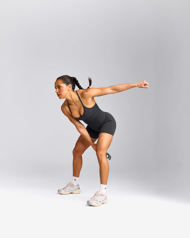 EnhanceLift™ Seamless Strappy Racer Tank Top with Built in Bra Shelf with Grey Logo | Coal