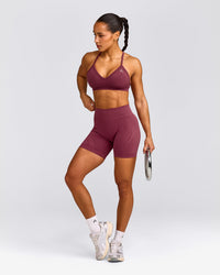 EnhanceLift™ Seamless Strappy Sports Bra with Grey Logo | Burnt Maroon Red