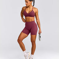 EnhanceLift™ Seamless Strappy Sports Bra with Grey Logo | Burnt Maroon Red